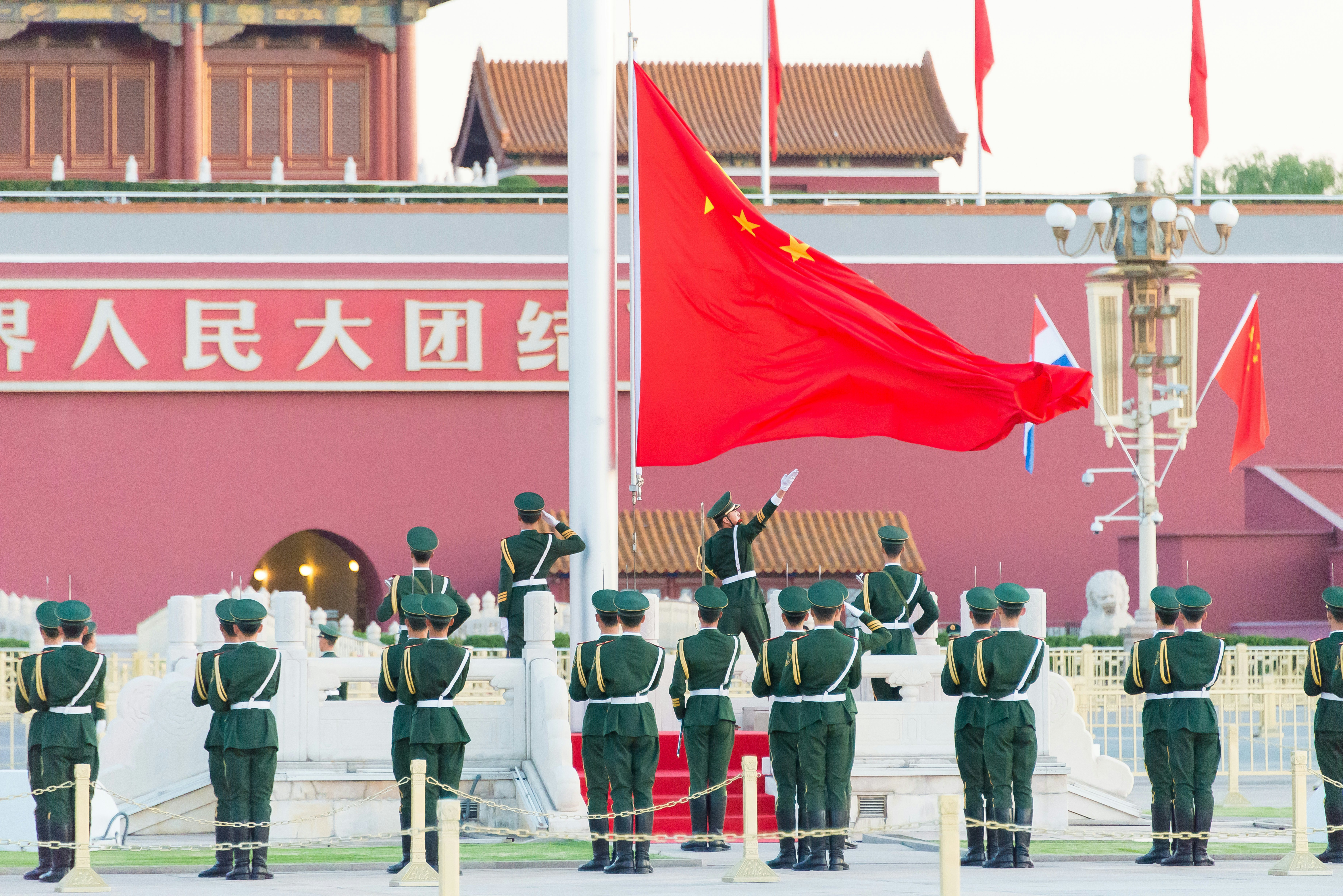 Troops raise the Chinese flag in Tian’anmen Square, Beijing, China