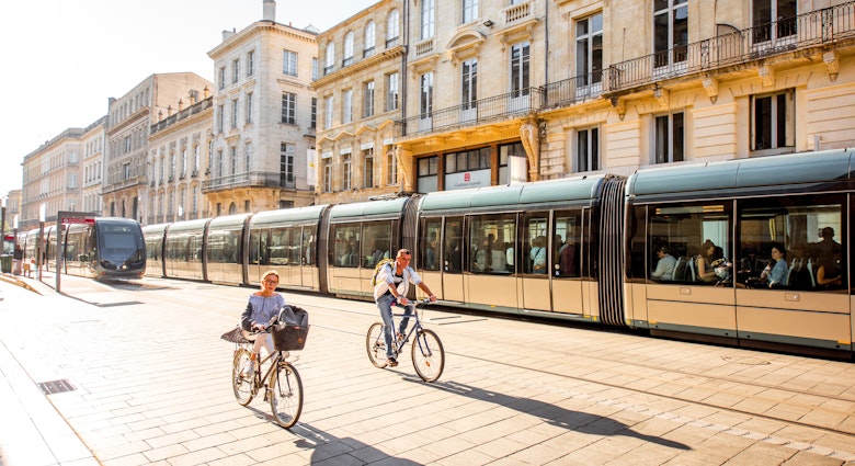 BORDEAUX, FRANCE - May 24, 2017: Street view with people ride a bicycles and modern trams in Bordeaux city during the morning in France
674653339