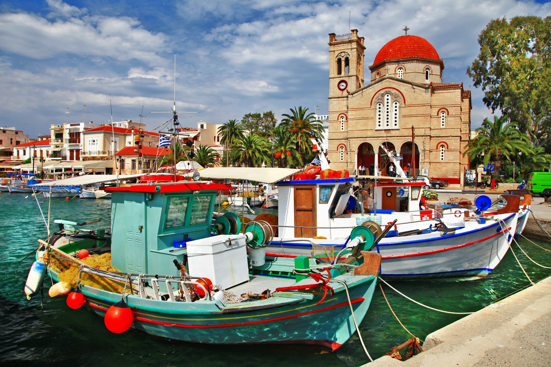 Colorful wooden boats docked in a small island harbor