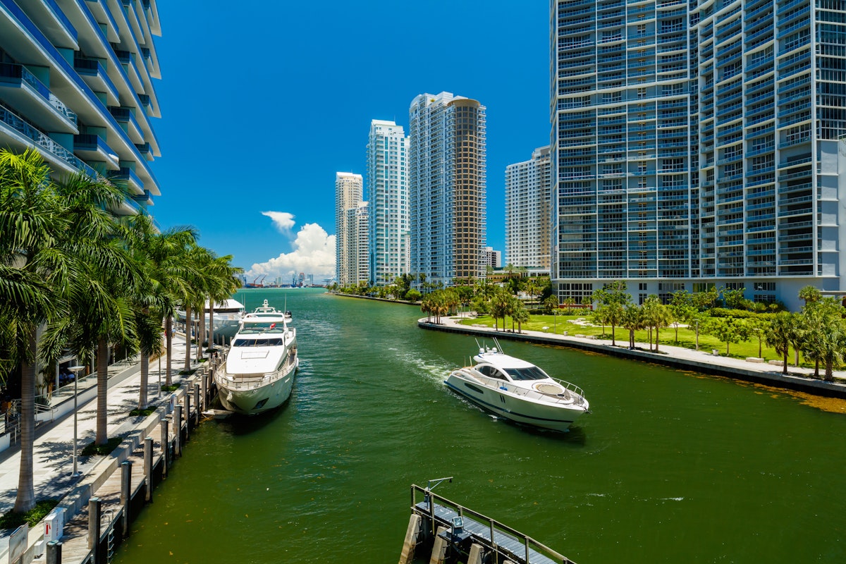 Downtown Miami along the Miami River inlet with Brickell Key in the background and yacht cruising by.
289314128
outdoor, downtown, skyscraper, metropolitan, usa, river, day, urban, condominium, sunny, luxury, skyline, yacht, condo, building, miami, modern, dock, metropolis, boating, lifestyle, architecture, city, colorful, beauty, boat, beautiful, water, nature, pretty, florida, vacation, inlet, landscape, cityscape, riverwalk, destination, shore, key, travel, brickell, united, states, blue, sky, bay, side