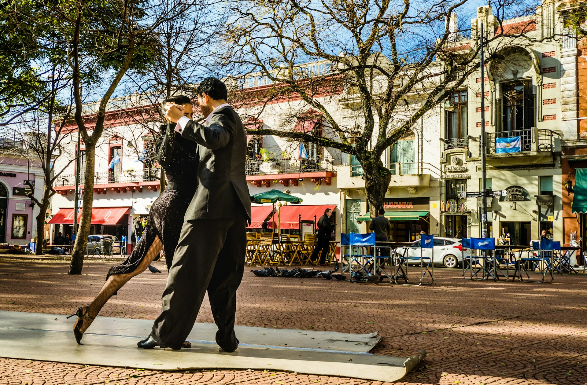 Two tango dancers performing at Plaza Serrano in San Telmo neighborhood of Buenos Aires