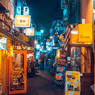 Shinjuku, Tokyo, Kanto region, Japan. Tiny alleys crowded with night bars and clubs at Golden Gai district.