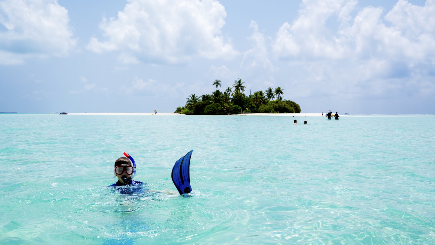 Young boy snorkeling and having fun in shallow water on small island beach in April, Maldives. In background there are some people in water and he is surrounded with turquoise water while horizon and small island are far back. It is tropical paradise island not far from Maafushi island and is visited from Maafushi Island on day tour, Maldives.
1041746754
maafushi, kaafu atoll