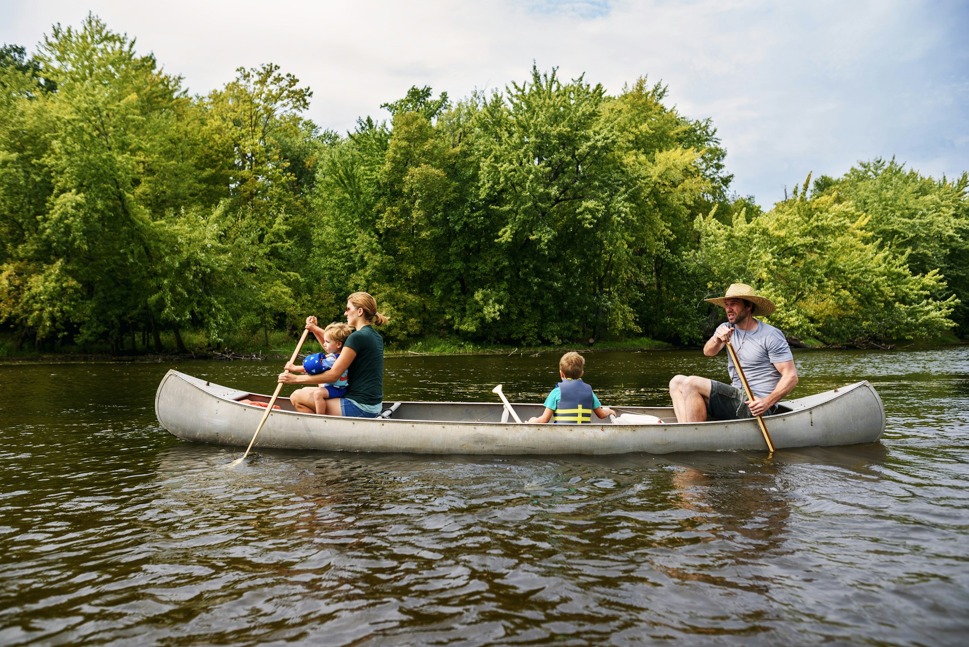 A family canoeing on a river in the USA