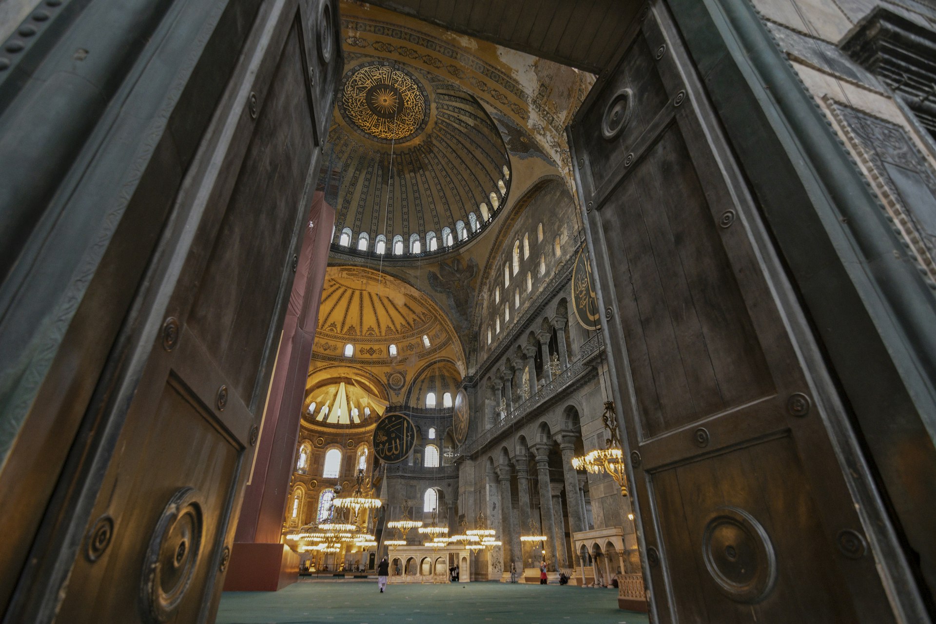 Interior view of The Hagia Sophia Grand Mosque, converted into the mosque from a museum in 2020. Local people waiting for prayer time (namaz) and tourists visiting the famous mosque of Istanbul, Turkey.