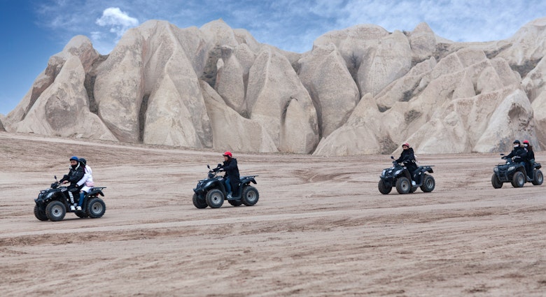 Goreme, Turkey - January 8, 2018: Group of happy tourists enjoying a quad bike ride on the mountains road in countryside over Red Valley in Cappadocia, Central Anatolia. Nevsehir, Goreme National Park
1302131869