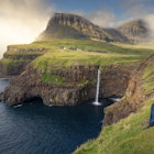 Man with red jacket sits at cliff in front of MÃºlafossur waterfall with GÃ¡sadalur village on Vagar island, Faroe Islands"n
Man with red jacket sits at cliff in front of Múlafossur waterfall with Gásadalur village on Vagar island, Faroe Islands"n
1329702595
faeroe islands, spcc, múlafossur, gásadalur, cliffs, rocks, ocean, coast, man, male, person, clouds, vagar, landscape, scenery, travel destination