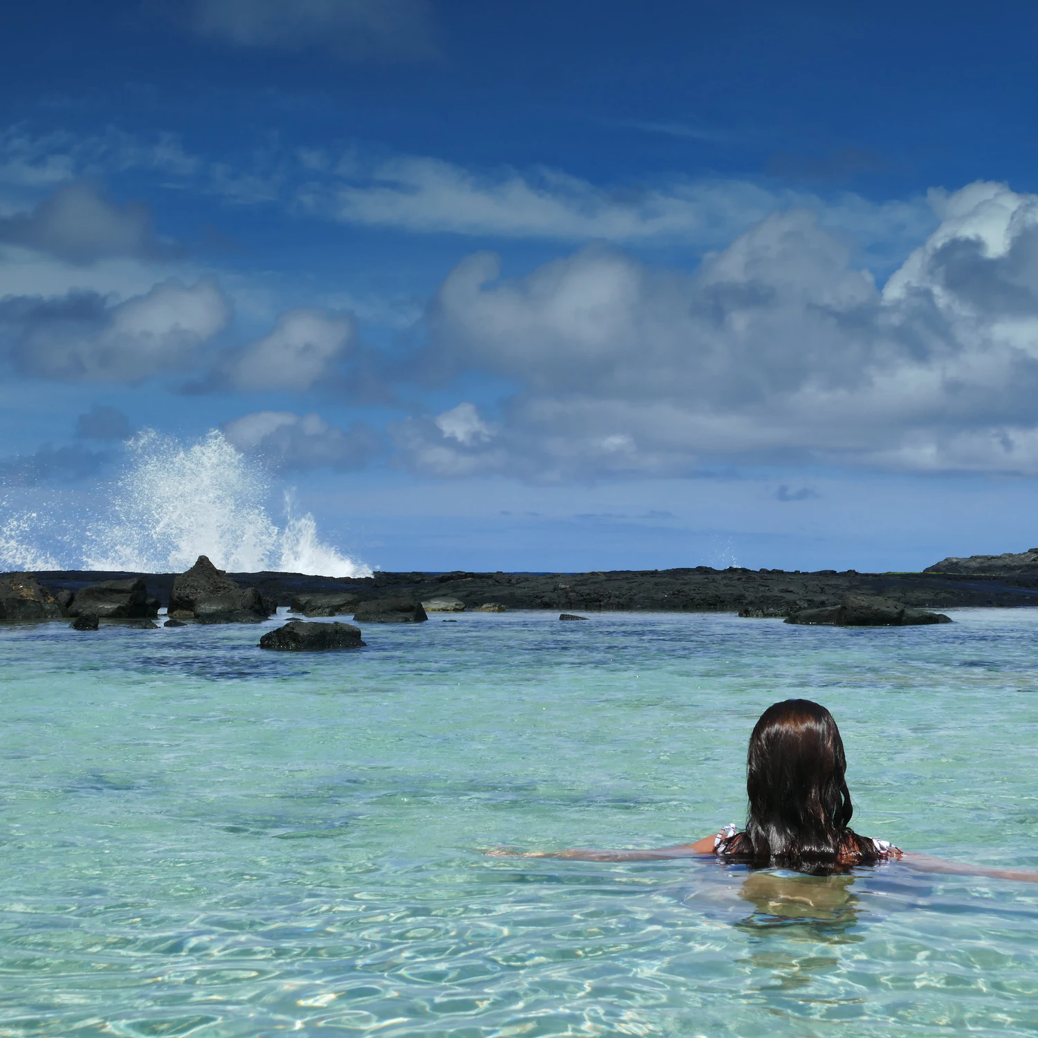 1343022158
Wawaloli Beach Park, Kalaoa, Kailua-Kona, Hawai’i - September 18, 2019: Woman enjoys the protected waters of the tide pools at Wawaloli Beach while the surf crashes in the distance.
Wawaloli Beach Park, Kalaoa, Kailua-Kona, Hawai’i - September 18, 2019: Woman enjoys the protected waters of the tide pools at Wawaloli Beach while the surf crashes in the distance.