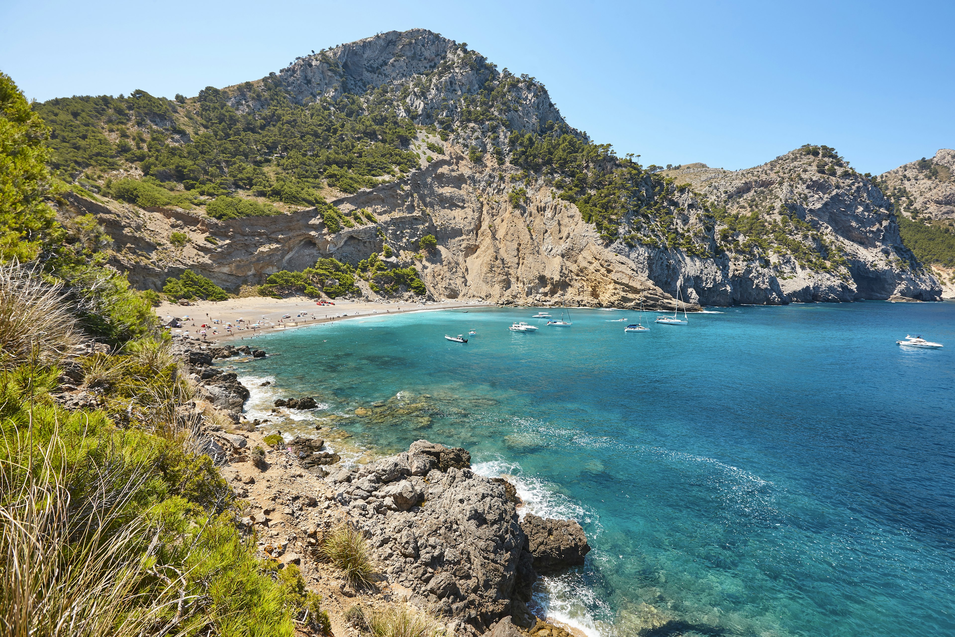 Turquoise waters lap at a small secluded bay