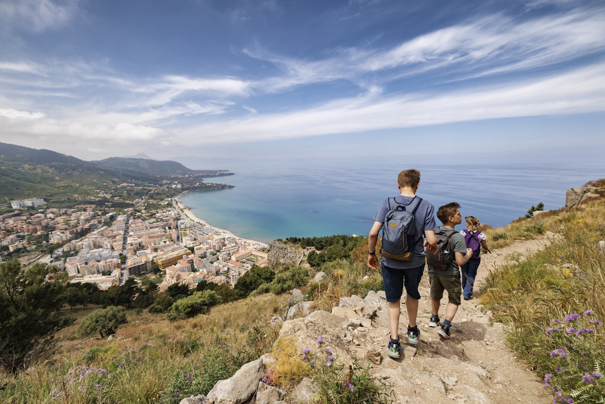 Mother and two teenage sons are hiking in Sicily, Italy. They are hiking on the hill near the town of Cefalu. Sunny spring day...Canon R5
1399004882