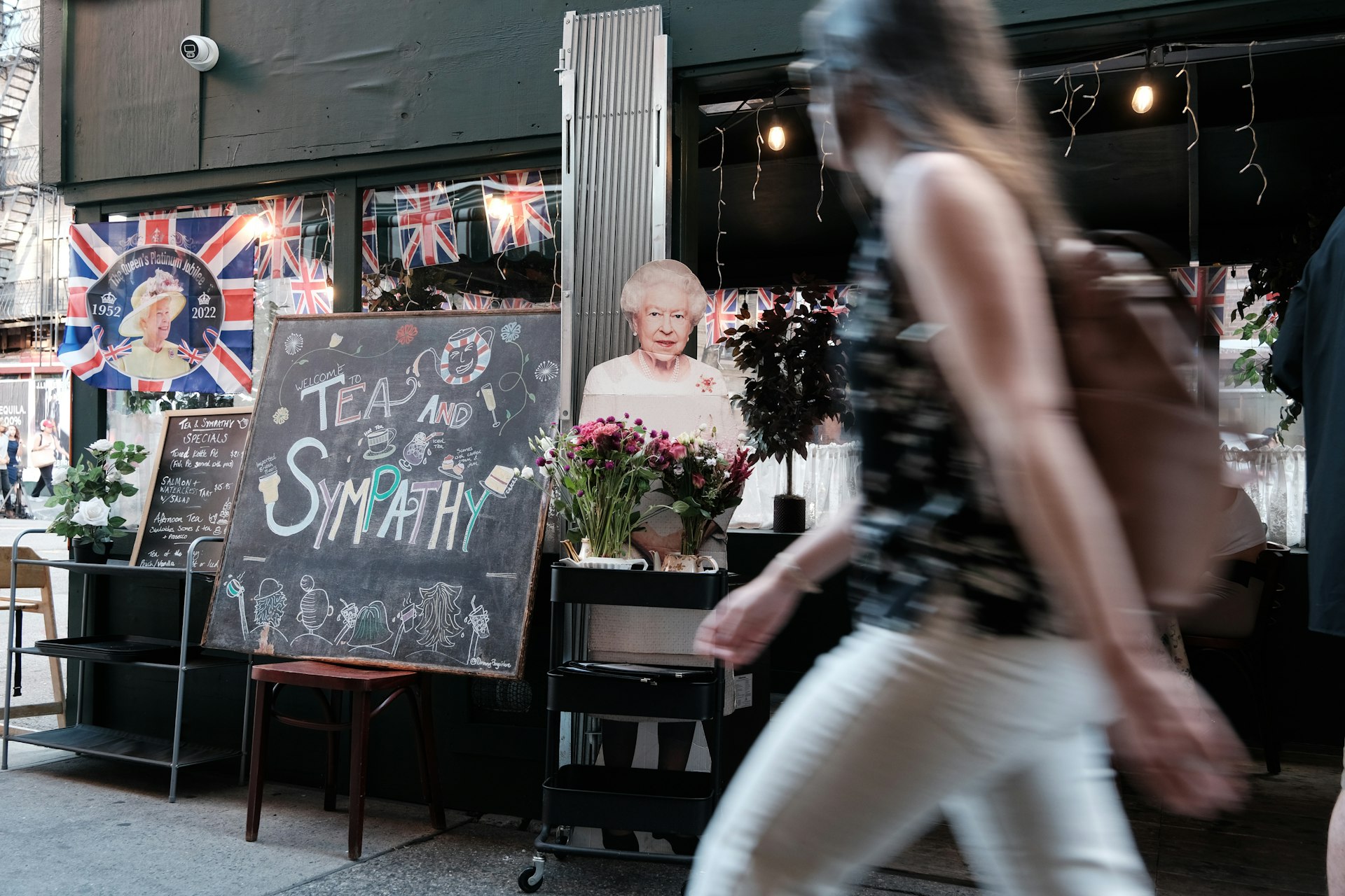 Displays of the late Queen Elizabeth are assembled outside of Tea & Sympathy, West Village, New York City, New York, USA