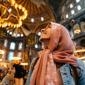 Young woman enjoying a view inside of Hagia Sofia in Istanbul, Turkey.
1496877705