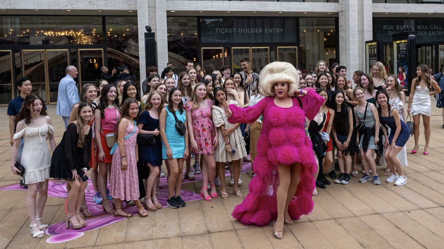 NEW YORK, NEW YORK - JULY 08: Lady Bunny (C) jumps into a photo with students from the Ellison Ballet program outside of The Wedding: New York's Biggest Day at David Geffen Hall at Lincoln Center on July 08, 2023 in New York City. Lincoln Centerâ€™s Summer for the City event brought hundreds of couples together for an interfaith ceremony for those getting married for the first time, renewing vows or simply celebrating their love for the city. Due to inclement weather the event was moved indoors. (Photo by Alexi Rosenfeld/Getty Images).NEW YORK, NEW YORK - JULY 08: Lady Bunny (C) jumps into a photo with students from the Ellison Ballet program outside of The Wedding: New York's Biggest Day at David Geffen Hall at Lincoln Center on July 08, 2023 in New York City. Lincoln Center’s Summer for the City event brought hundreds of couples together for an interfaith ceremony for those getting married for the first time, renewing vows or simply celebrating their love for the city. Due to inclement weather the event was moved indoors. (Photo by Alexi Rosenfeld/Getty Images).1526975384.couples, relationships, bestof, topix
1526975384
couples,  relationships,  bestof,  topix,  Adult,  Child,  Costume,  Dress,  Evening Dress,  Face,  Female,  Formal Wear,  Girl,  Handbag,  Head,  High Heel,  People,  Person,  Photography,  Portrait,  Shoe,  Skirt,  Urban,  Woman