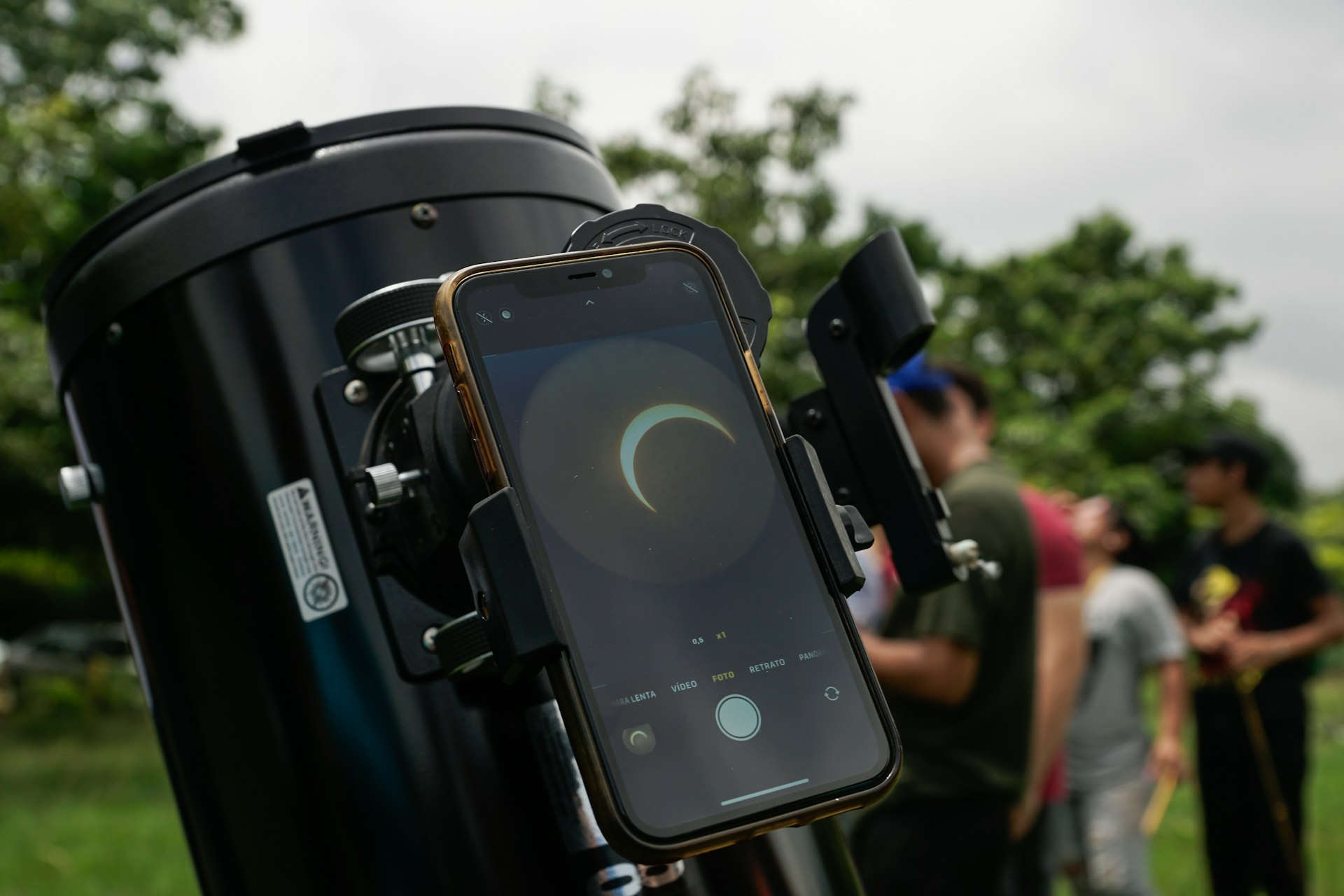 The solar eclipse as shown through a mobile phone attached to a telescope