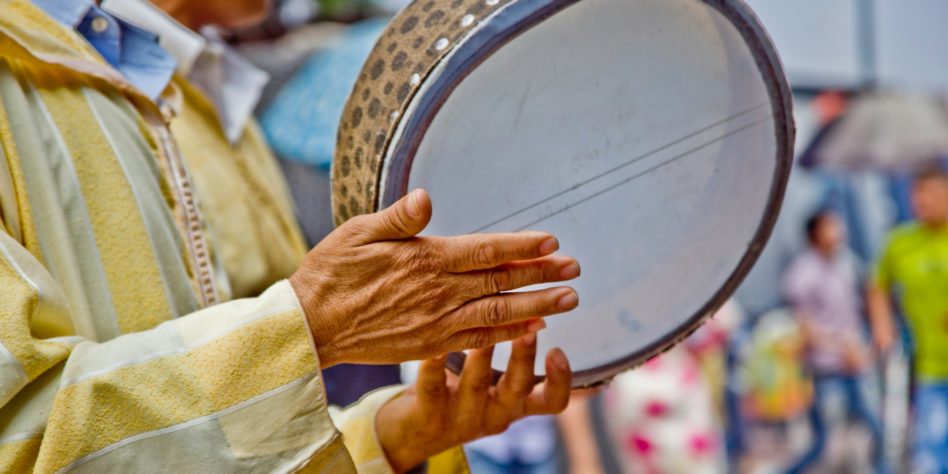 A musician playing a tambourine in Agadir, Morocco