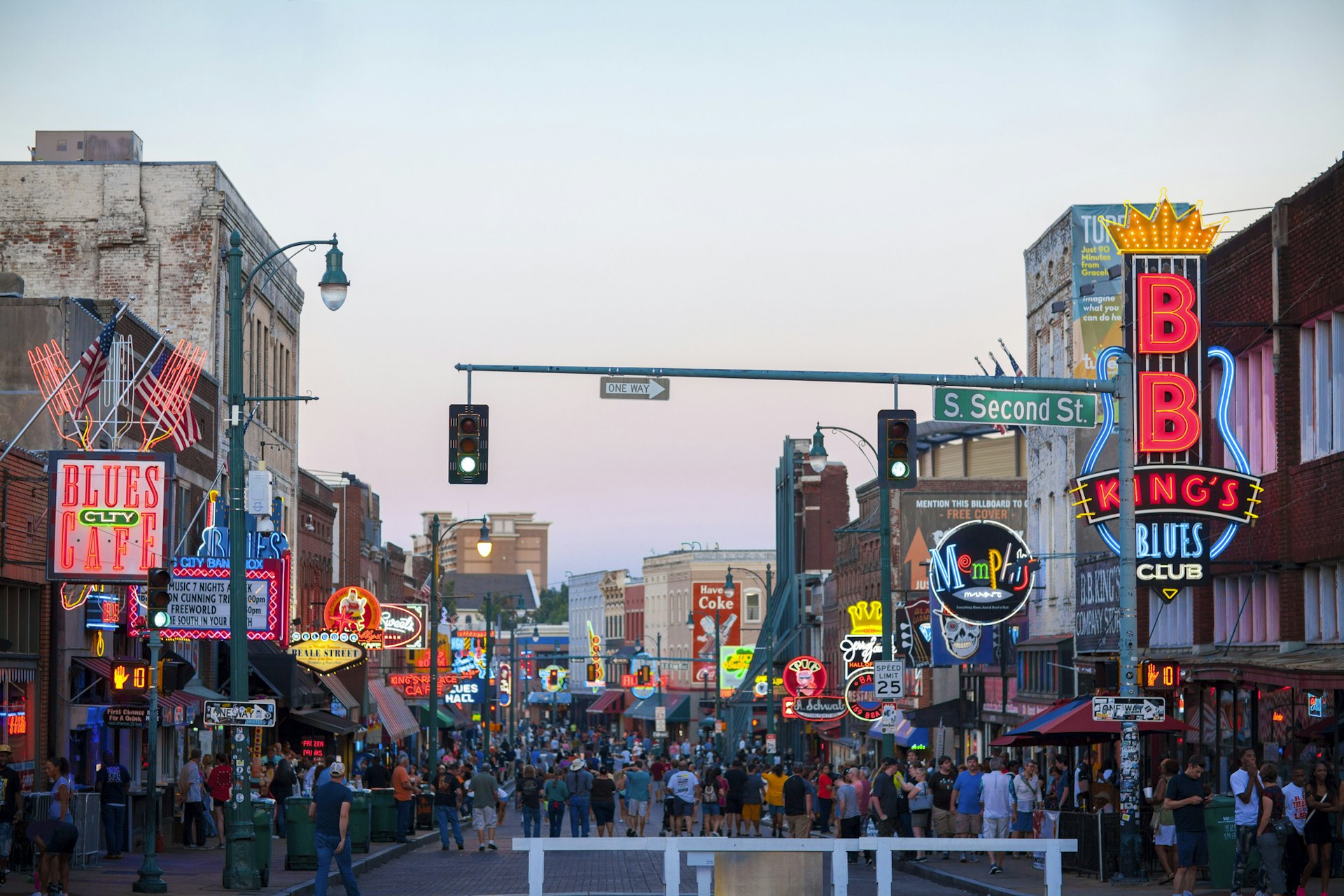 Beale Street at night with crowds of people outside live music venues