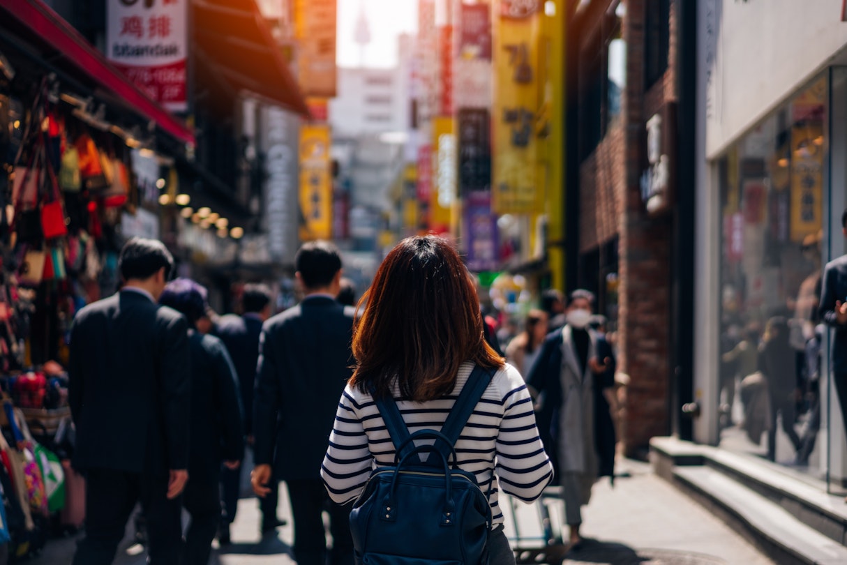 Young asian woman traveler traveling and shopping in Myeongdong street market at Seoul, South Korea. Myeong Dong district is the most popular shopping market at Seoul city.
947075210