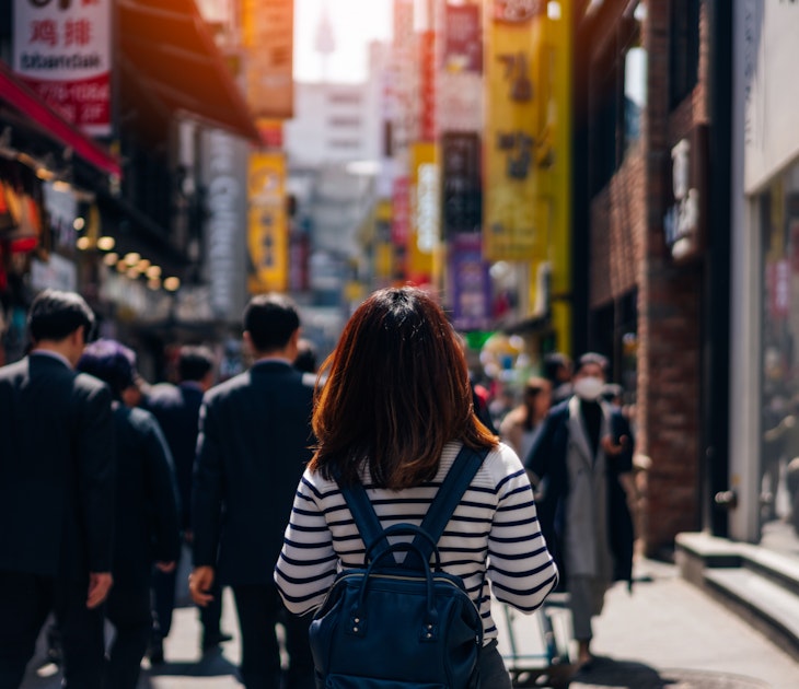 Young asian woman traveler traveling and shopping in Myeongdong street market at Seoul, South Korea. Myeong Dong district is the most popular shopping market at Seoul city.
947075210