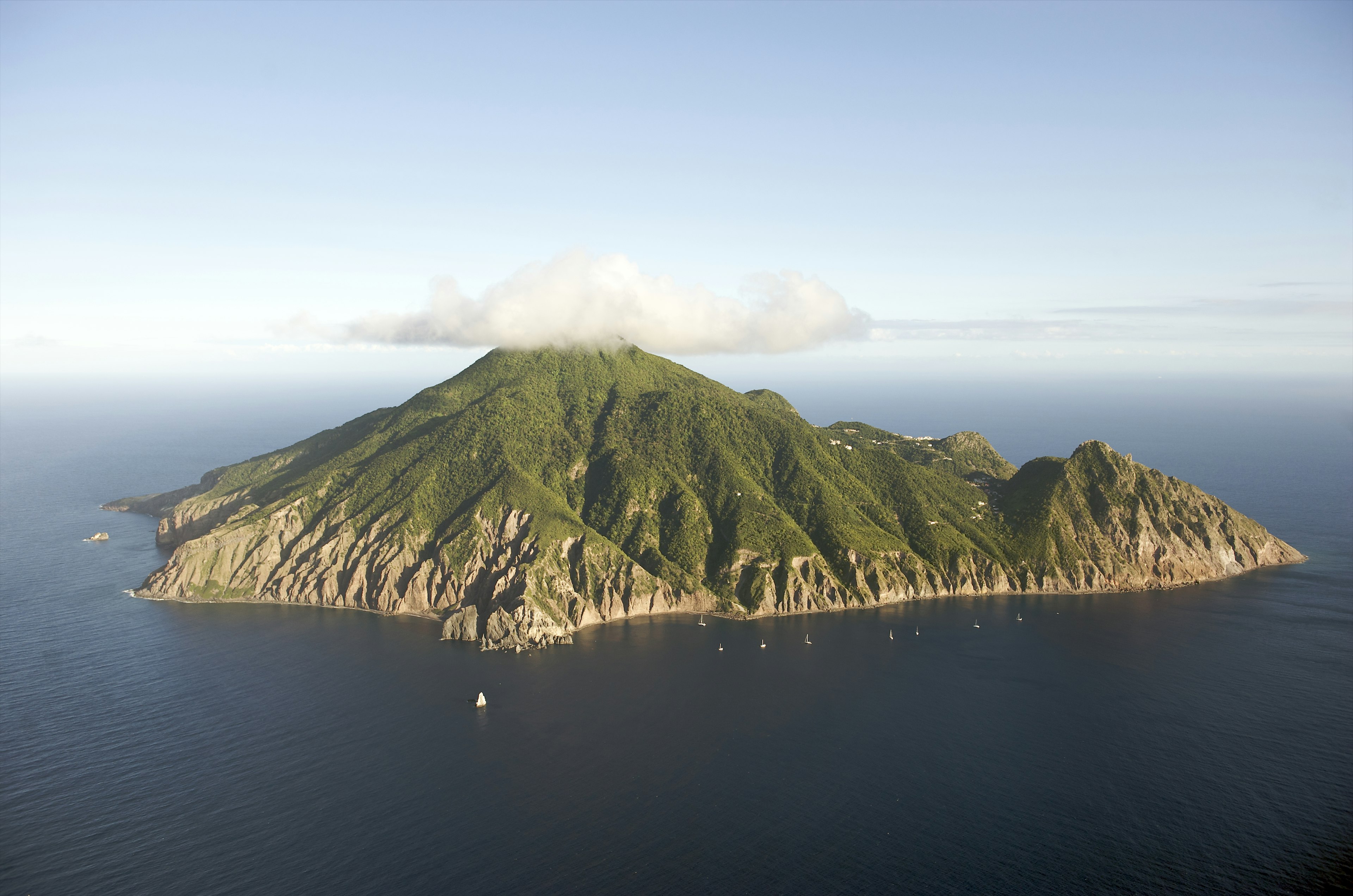 A cloud hugs the mountaintop of Saba, Caribbean Netherlands