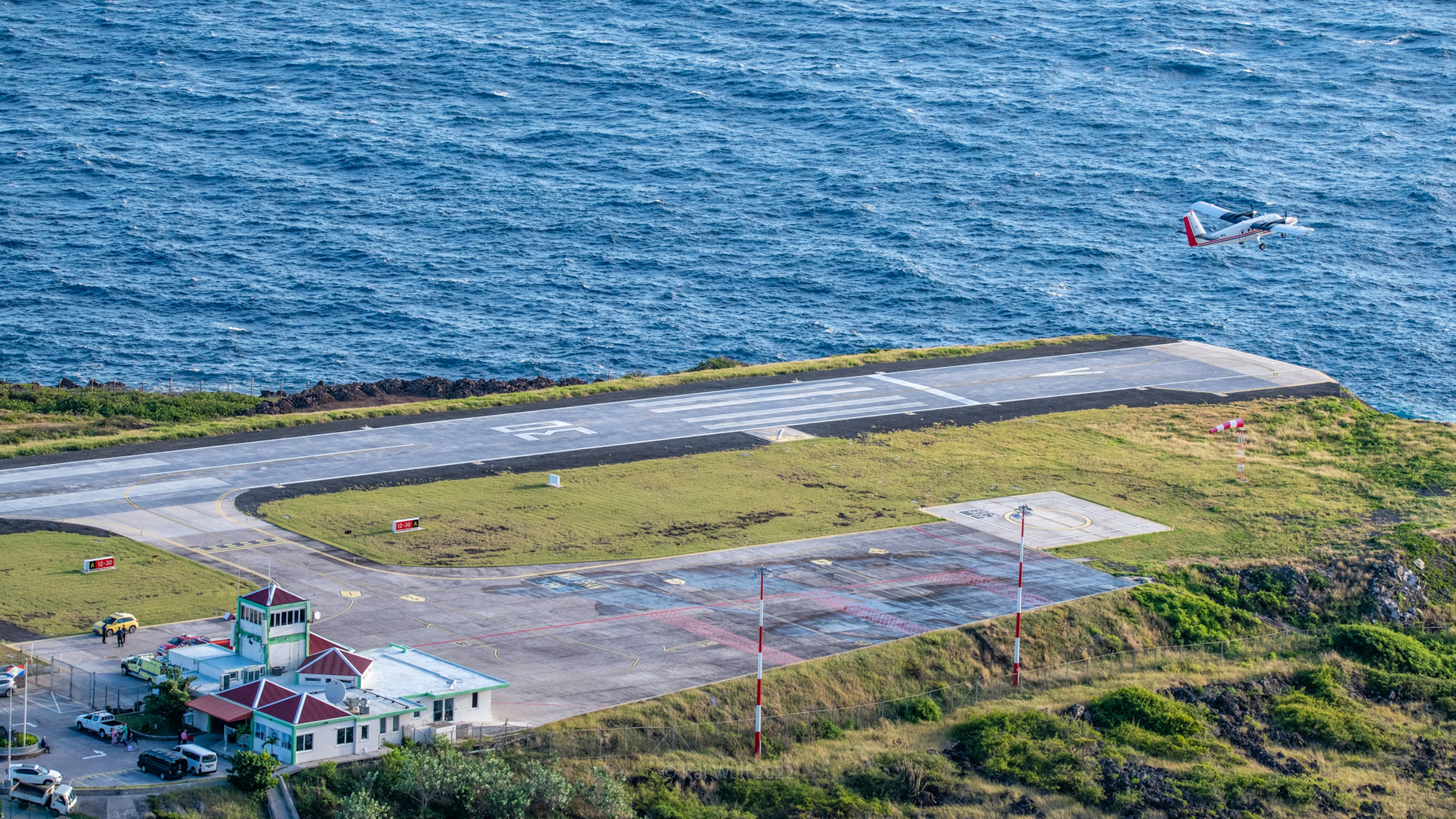 A plane takes off at the Juancho E. Yrausquin Airport on the Caribbean island of Saba. It is the shortest commercial runway in the world.