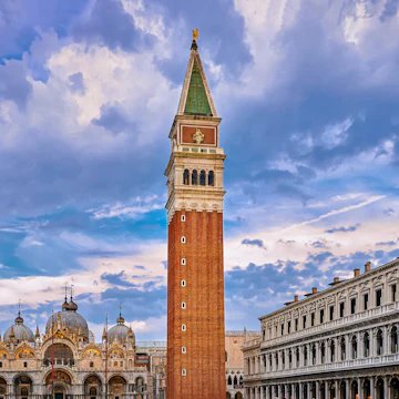 View of St Mark's square or piazza di San Marco, Venice, Italy, sundown on cloudy day. Bell tower or Campanile, St Mark's Basilica main facade and entrance and Procurate Vecchie building, beautiful sky and clouds, UNESCO World heritage city.
1584875726
View of St Mark's square or piazza di San Marco, Venice, Italy in sundown on cloudy day. Campanile, St Mark's Basilica, Procurate Vecchie building