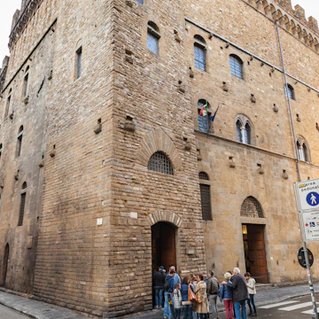 Tourists in line in Bargello palace in Florence.