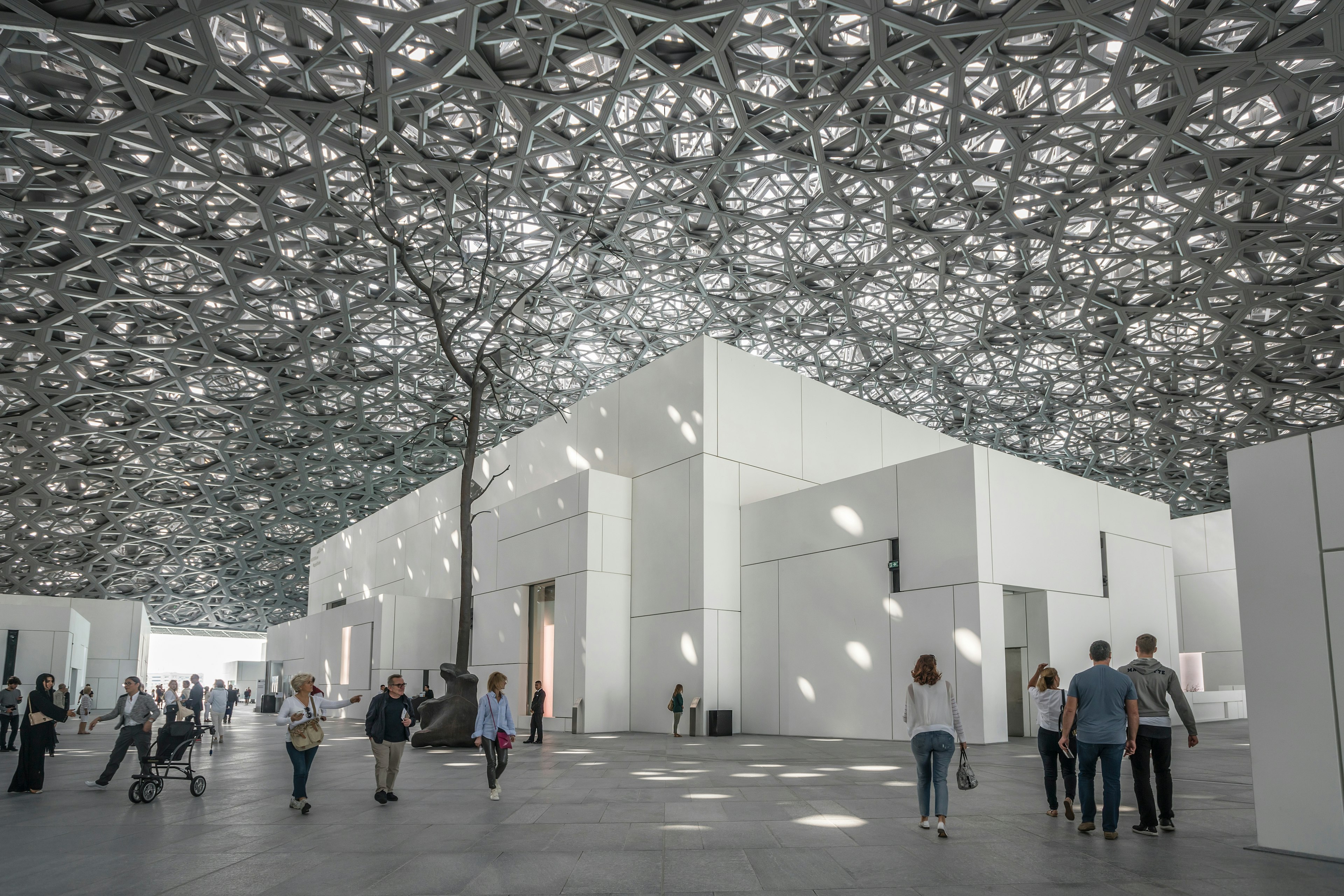 Interior of the Louvre Abu Dhabi under the “rain of light” dome, Abu Dhabi, United Arab Emirates