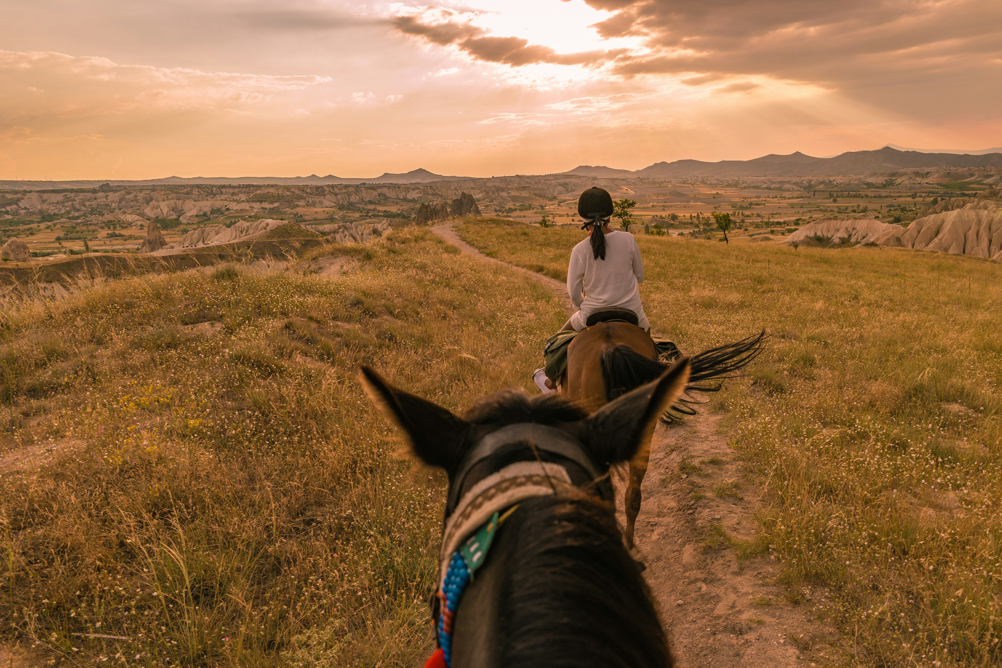 Horseback riding through the national Park in Cappadocia, Turkey,