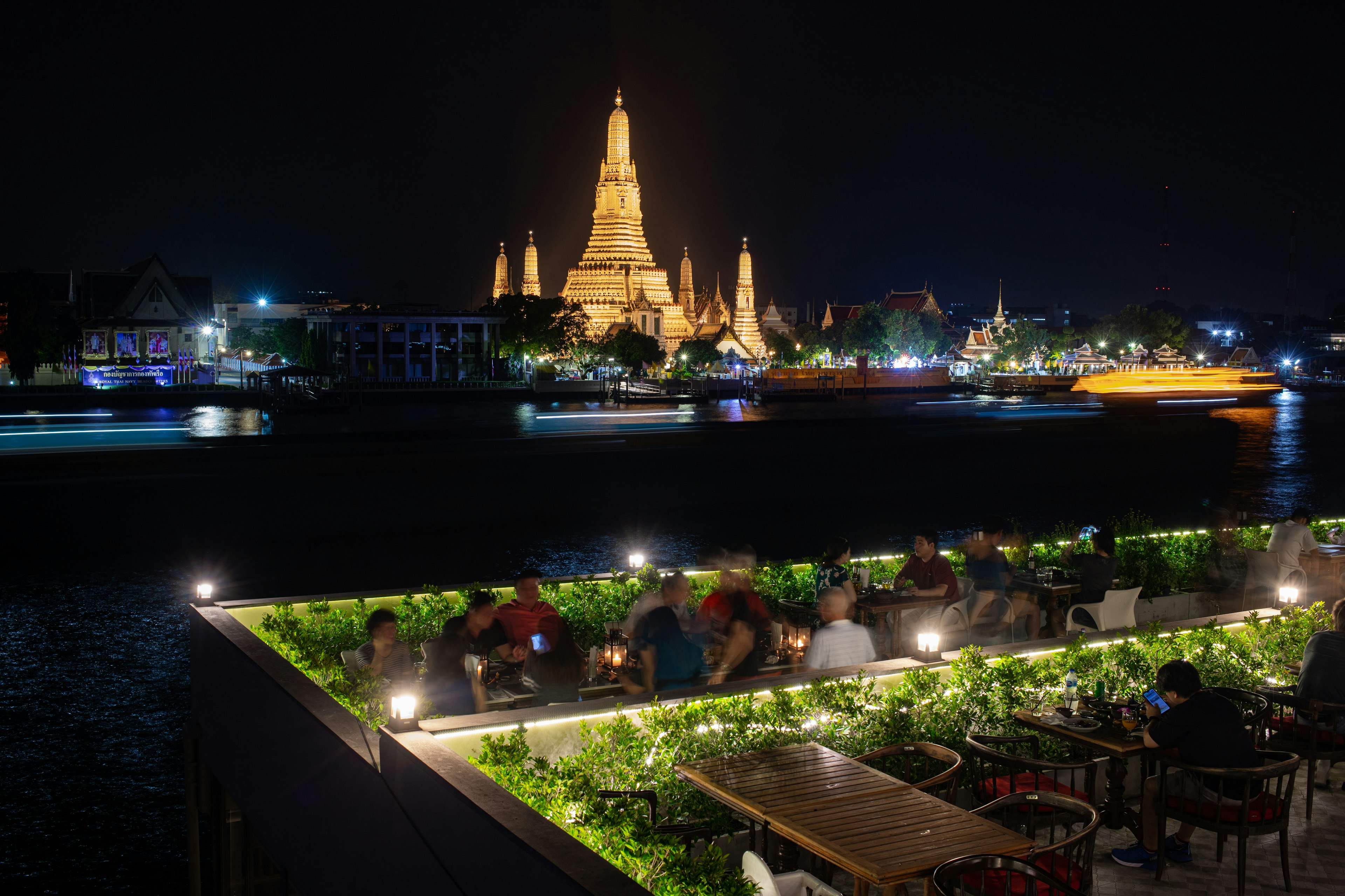 Wat Arun Great pagoda on Chao Phraya riverside view from Chom Arun Thai food restaurant