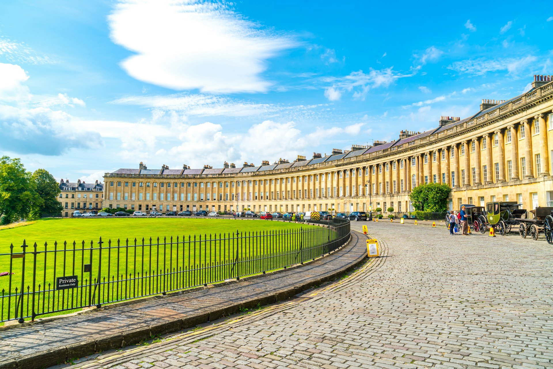 The famous Royal Crescent at Bath, a sweep of Georgian buildings facing a well-tended green.