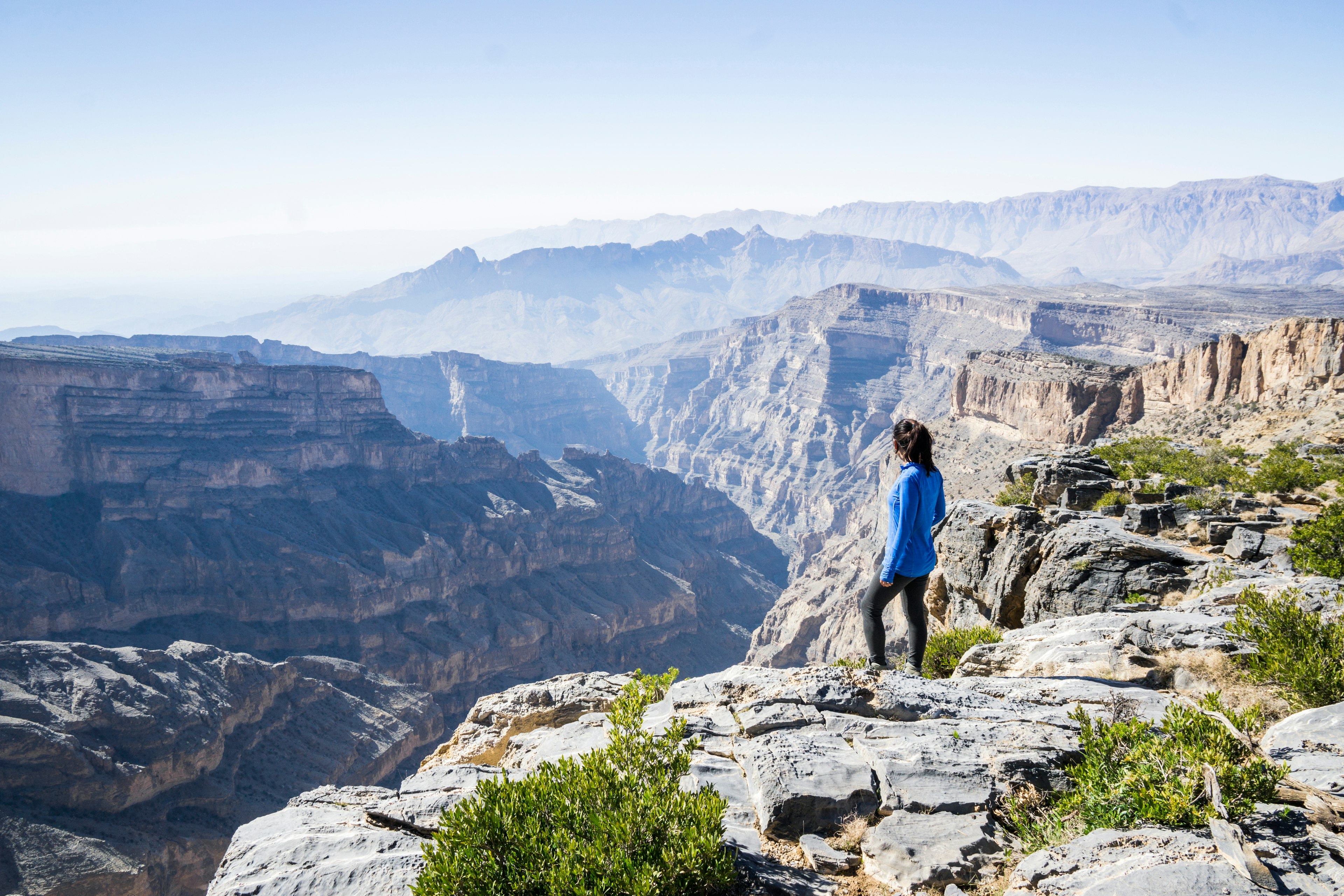 Solo woman hiking in Jabel Shams, Wadi Ghul, Oman Middle East