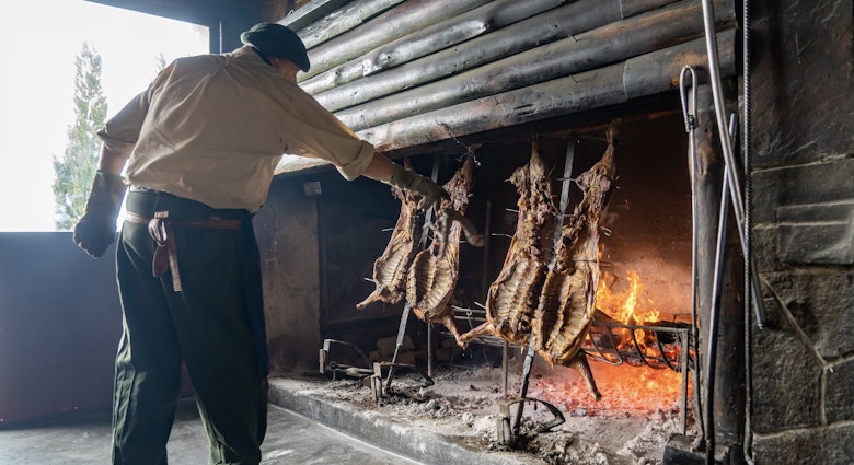 Argentina, Patagonia traditional lamb cooking on an open fireplace.; Shutterstock ID 2125211729; GL: 65050; netsuite: Lonely Planet Online Editorial; full: Where to eat and drink in Argentina; name: 65050
2125211729
america, argentina, argentinian, asada, asado, asador, barbecue, beef, cook, cooked, cooking, cordero, cuisine, culture, delicious, dish, estancia, fire, fire gastronomy, fireplace, firewood kitchen, flame, food, gastronomy, gaucho, grill, grilled, hot, lamb, lamb ribs, meat, pampas, patagonia, patagonia argentina, raw, roast, roasted, roasting, rotisserie, rustic, sheep, smoke, south, tradition, traditional, traditional kitchen, travel, travel destination, typical, vertical
