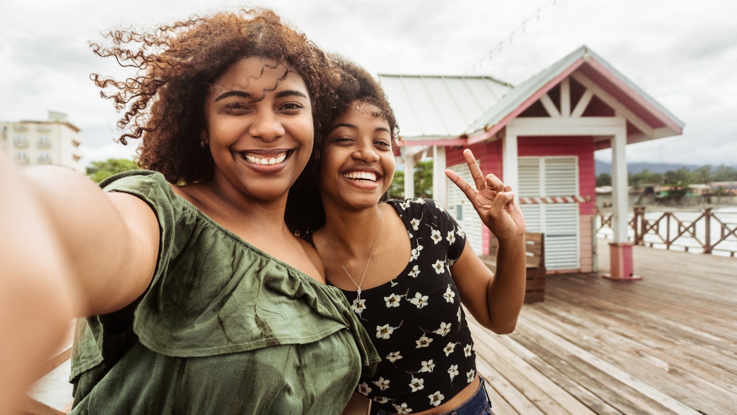 Young women at Tourist Pier of La Ceiba, Happy friends tourists visiting Honduras famous landmark.; Shutterstock ID 2125965536; GL: 65050; netsuite: Online Editorial; full: Things to know Honduras; name: Bailey Freeman
2125965536