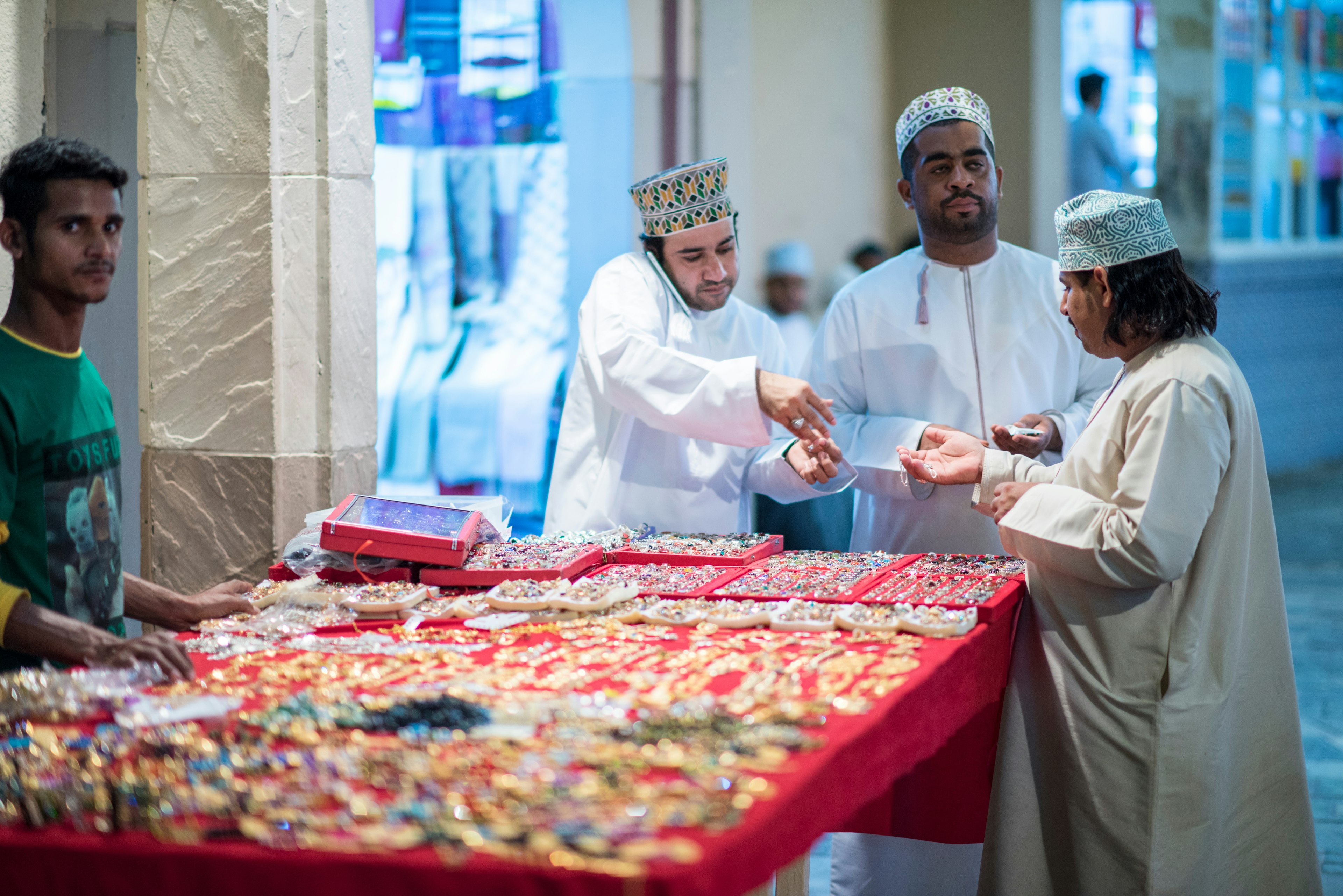 Merchants in market shops of the old town Mutrah, Muscat, Oman, Middle East