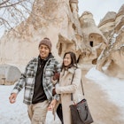 young asian tourist couple walking in pasabagi valley and cave in cappadocia goreme turkey; Shutterstock ID 2192189409; GL: 65050; netsuite: Online ed; full: Cappadocia budget; name: Claire N
2192189409