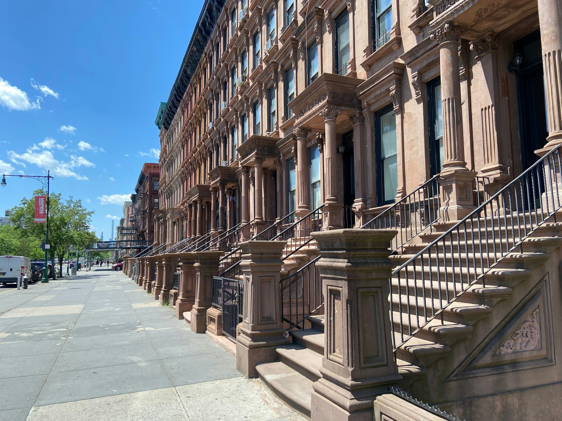 A row of historic Harlem brownstones on Lenox Avenue, Harlem, New York City, New York, USA