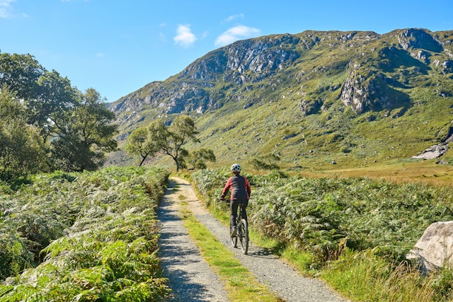 A cyclist in Lough Beagh, Glenveagh National Park, near Churchill, Donegal, Ireland