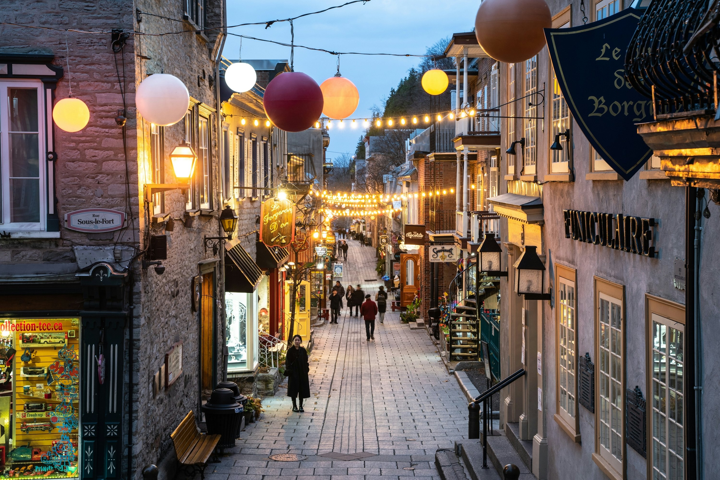 View of historic lower Québec City in Canada seen at night with people and lights