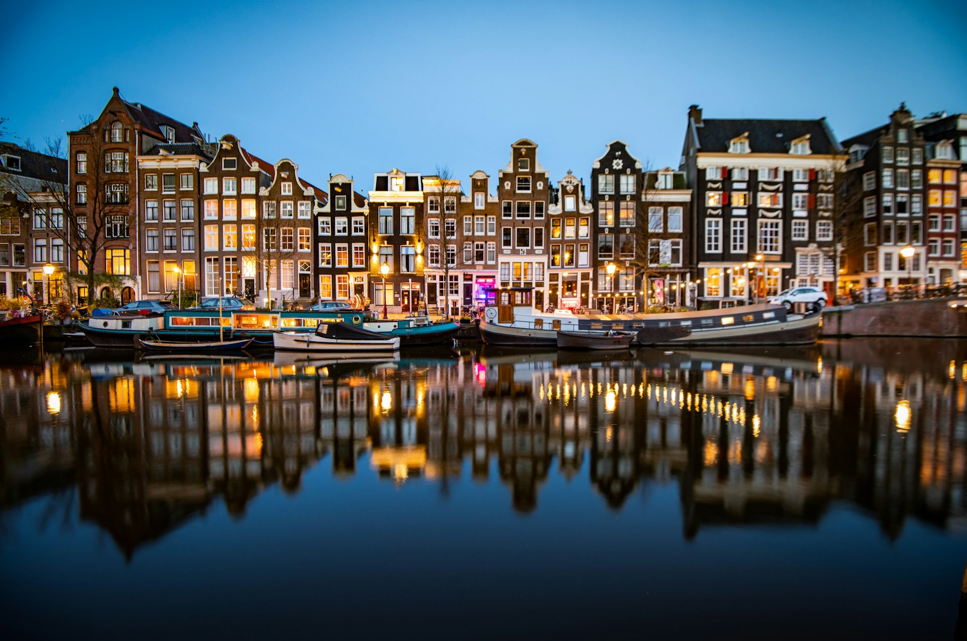 Historic homes along the Singel canal after dark, Amsterdam, the Netherlands