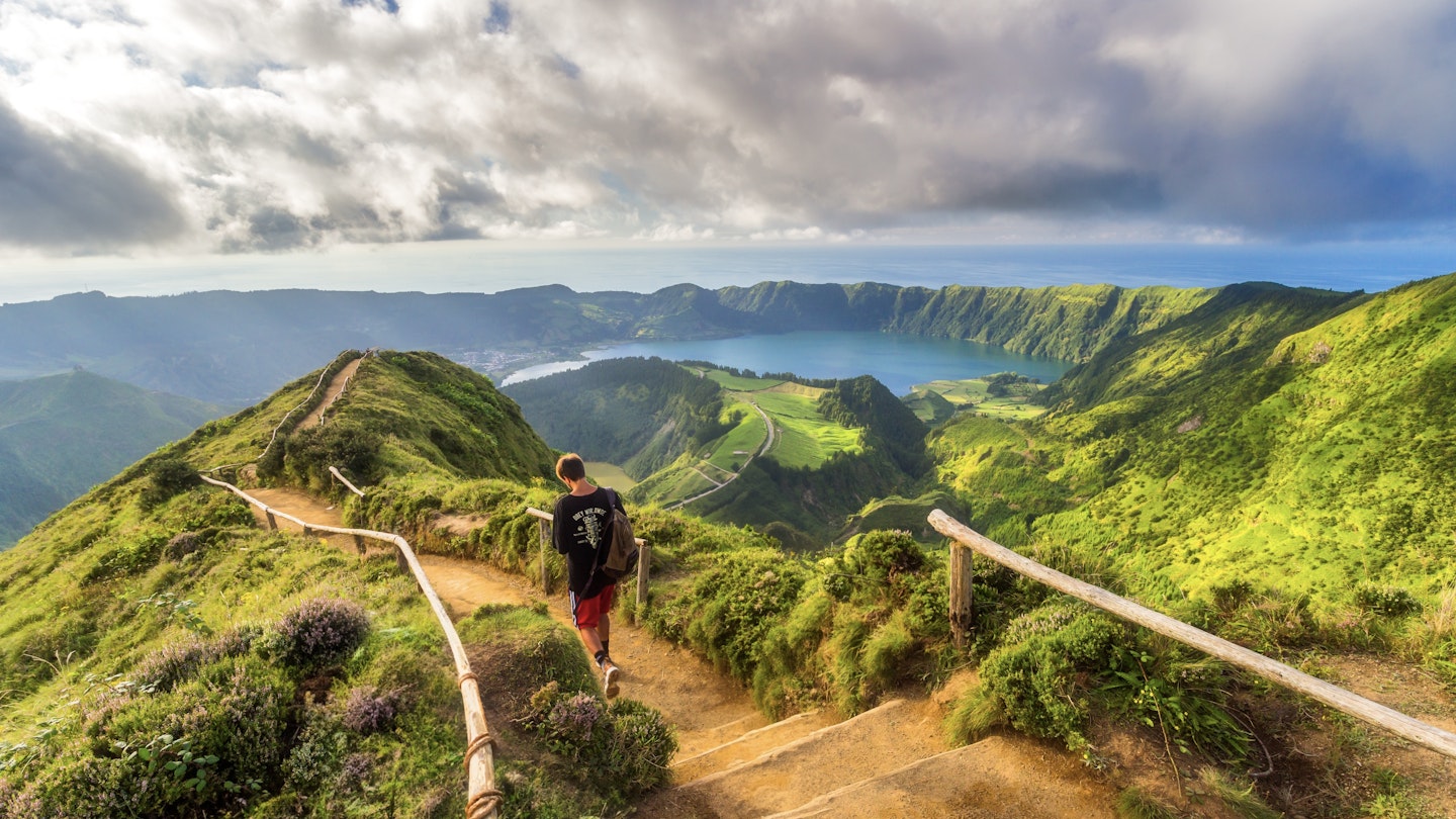 View of Sete Cidades near Miradouro da Grota do Inferno viewpoint, Sao Miguel Island, Azores, Portugal. ; Shutterstock ID 2311721619; GL: 65050; netsuite: Lonely Planet Online Editorial; full: First-timer's guide to the Azores; name: Brian Healy
2311721619
adventure, azores, background, blue, cidades, cloud, crater, delgada, europe, field, forest, green, hike, hiking, hill, island, lagoon, lake, landscape, miguel, mountain, nature, ocean, outdoor, park, path, peak, ponta, ponta delgada, portugal, sao, sao miguel, scenic, sete, sete cidades, sky, so miguel azores, summer, tourism, trail, travel, trek, trekking, valley, view, viewpoint, volcanic, volcano