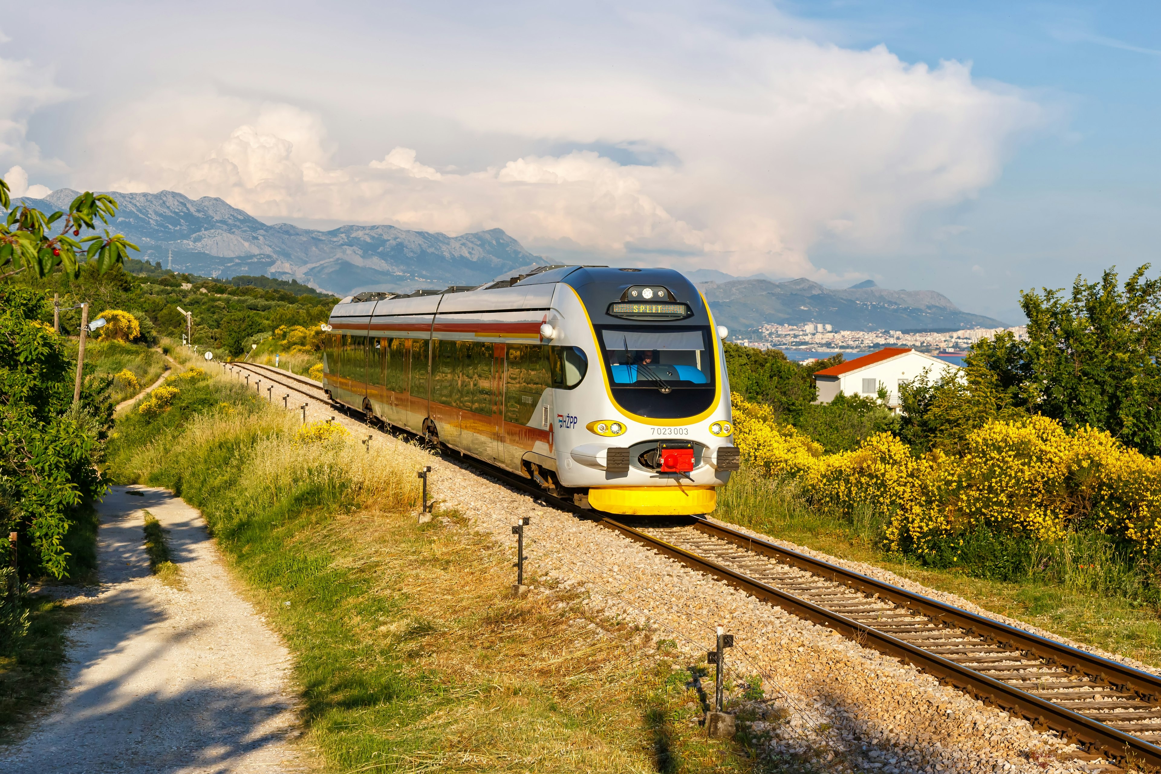 Commuter train of Croatian Railways Hrvatske Zeljeznice in Kaštel Stari, Croatia