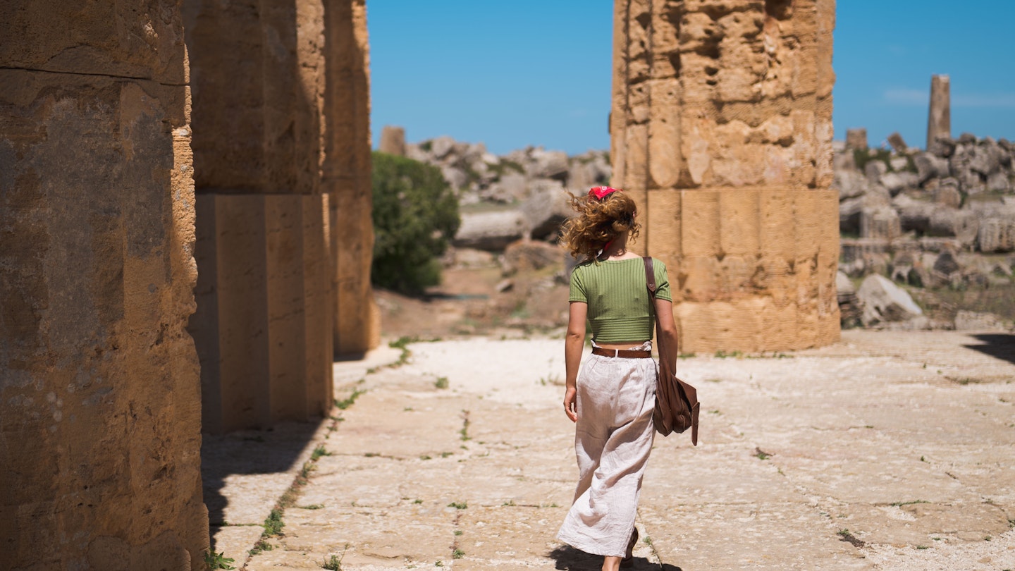 Captivating Journey: Young Girl with Bandana Exploring Ancient Greek Temples of Selinunte in Sicily among the prickly pears; Shutterstock ID 2347873817; GL: 65050; netsuite: Online Editorial; full: Best things to do in Sicily ; name: Bailey Freeman
2347873817