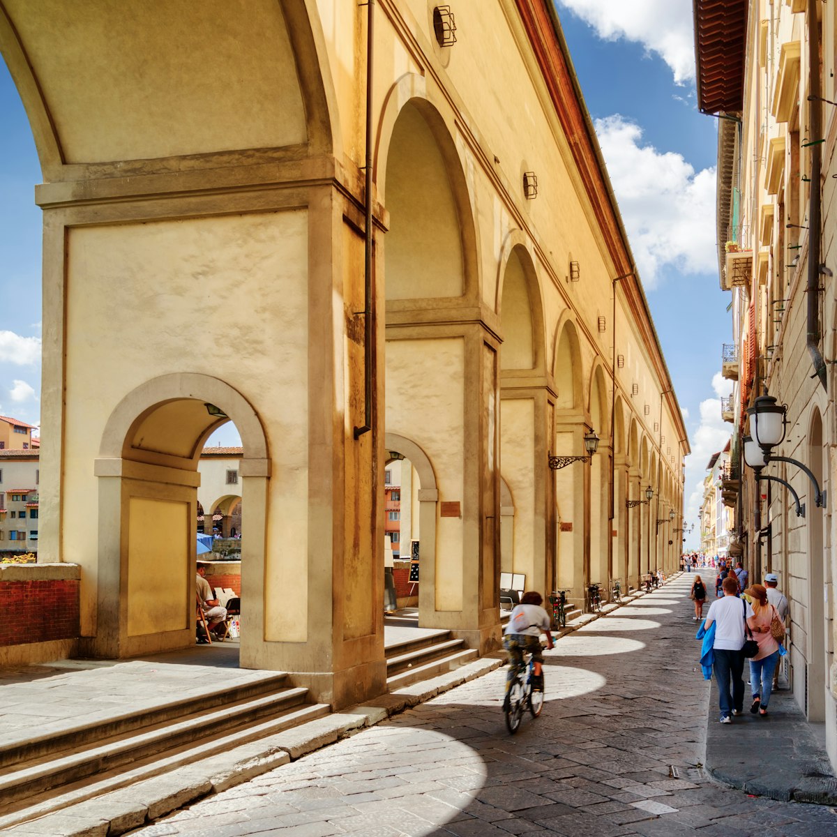 Arches of the Vasari Corridor (Corridoio Vasariano) in Florence, Tuscany, Italy. View of the Lungarno degli Archibusieri. Florence is a popular tourist destination of Europe.