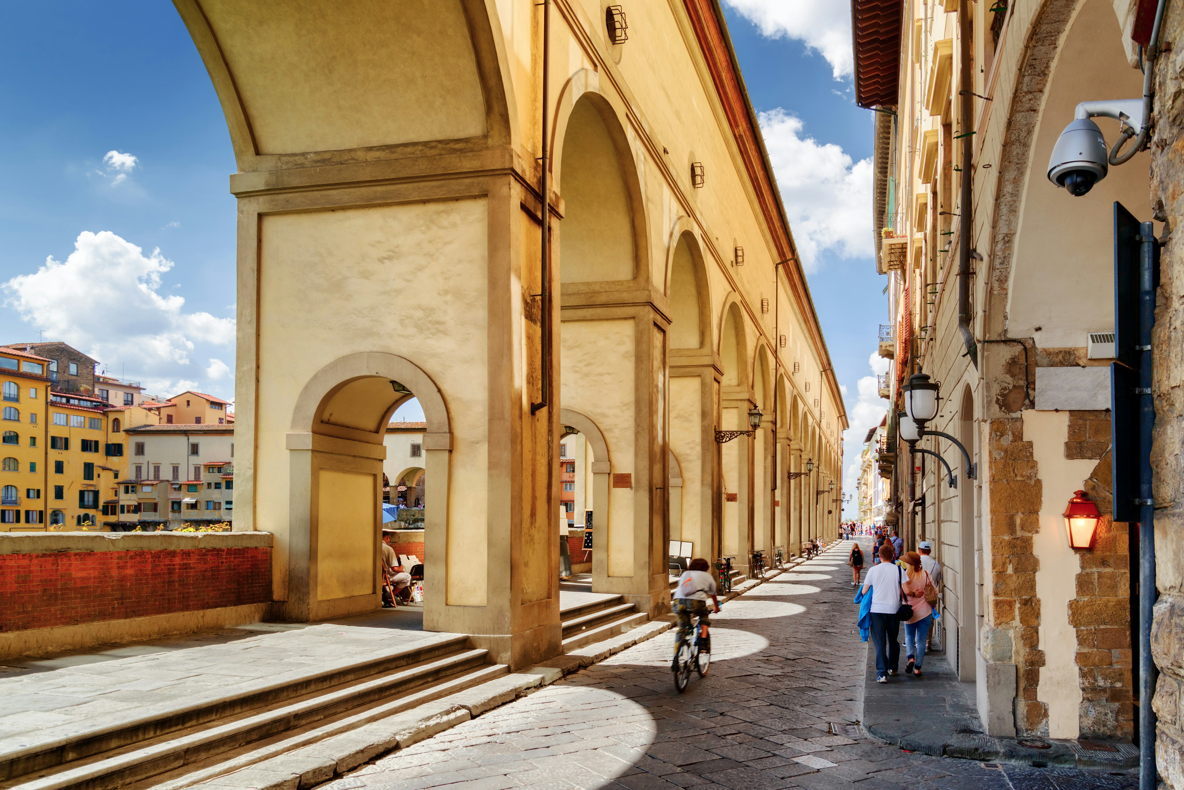 Arches of the Vasari Corridor (Corridoio Vasariano) in Florence, Tuscany, Italy. View of the Lungarno degli Archibusieri. Florence is a popular tourist destination of Europe.