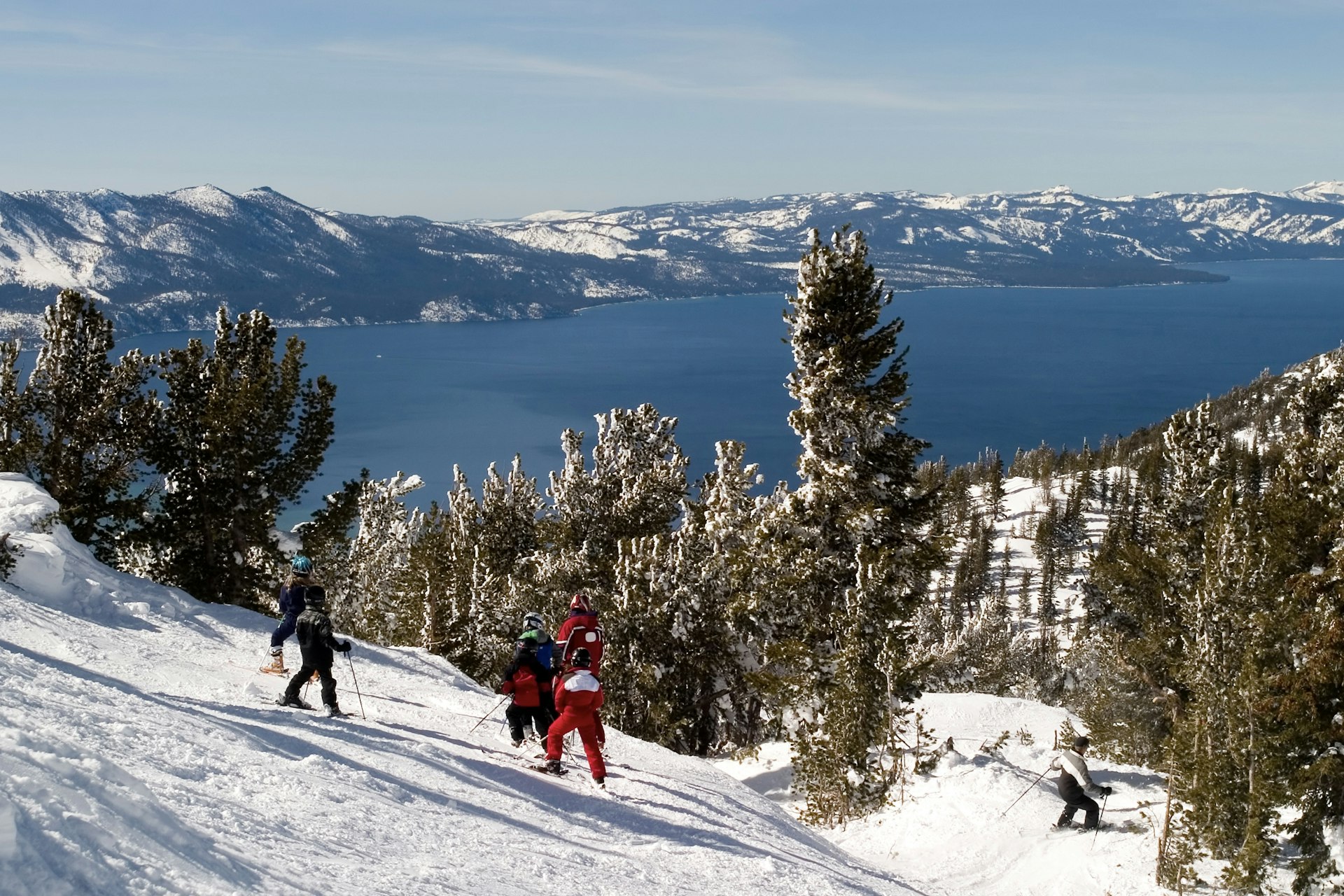 Skiers on a slope at Palisades Tahoe, Olympic Valley, California, USA