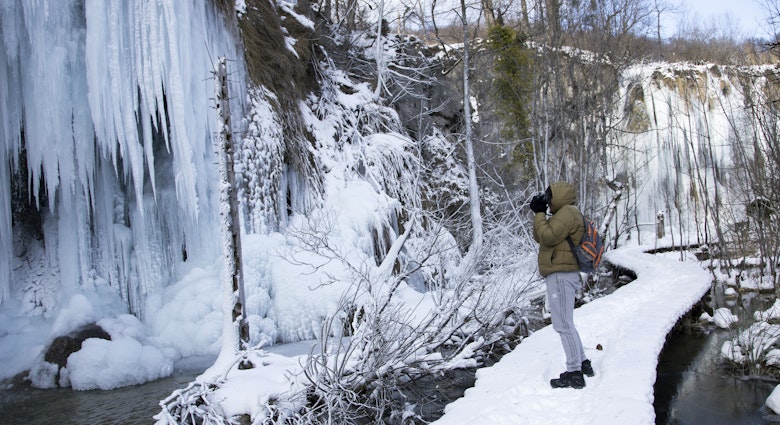 ZAGREB, CROATIA - JANUARY 08, 2017. - Tourist taking photo of frozen Plitvice lakes national park. ; Shutterstock ID 551122033; GL: 65050; netsuite: Lonely Planet Online Editorial; full: Croatia on a budget; name: Brian Healy
551122033
adventure, attraction, camera, cold, croatian national park, degrees, europe, famous, freeze, hike, hiking, ice, january, lake, landscape, man, minus, national, national park, nature, outdoor, park, path, photo, photographer, photography, plitvice, plitvice lakes, plitvicka jezera, recreation, season, snow, taking photo, tourist, touristic, trail, travel, traveler, tree, trekking, trip, water, waterfall, white, winter