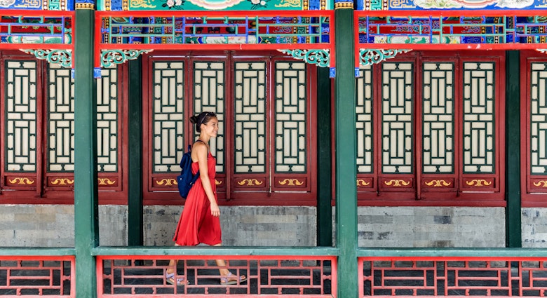 Young backpacker woman walking through old traditional long corridor at chinese temple, China summer travel. Asian girl visiting tourist attraction in Beijing.; Shutterstock ID 600269984; GL: 65050; netsuite: Online Editorial; full: Best things to do in Beijing; name: Bailey Freeman
600269984