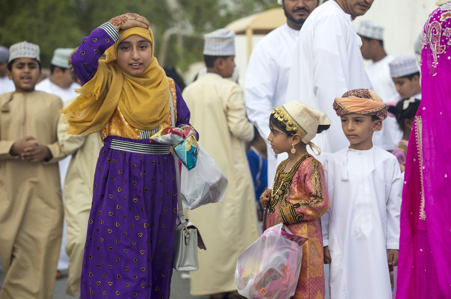 Children at a toy market on Eid al Fitr, Nizwa, Oman