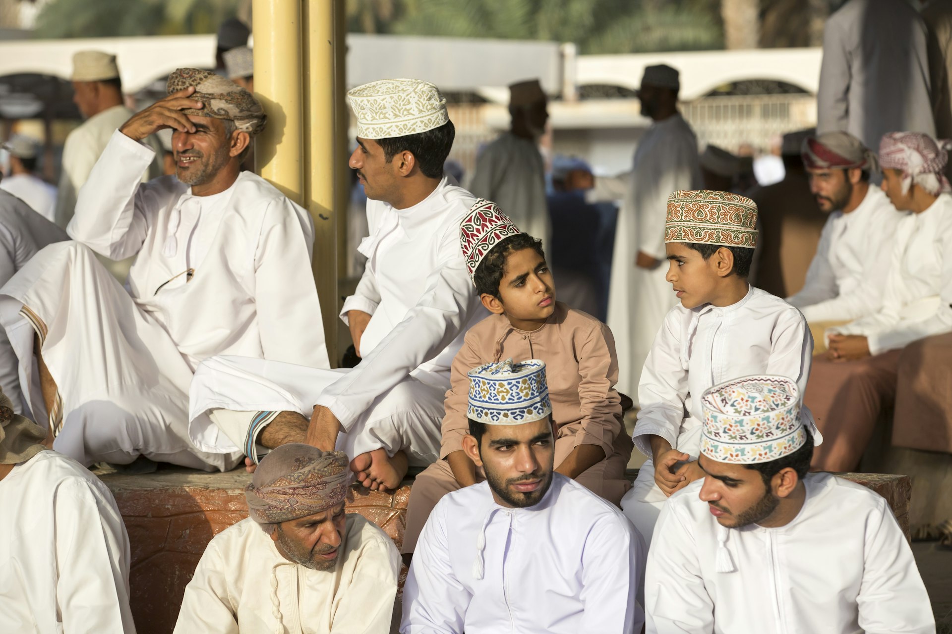 Men and boys at a habta Ramadan market, Nizwa, Oman