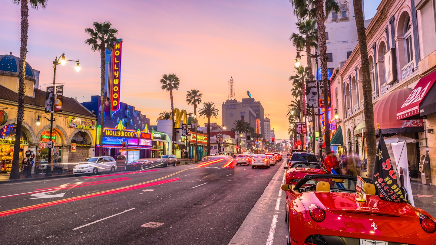 LOS ANGELES, CALIFORNIA - MARCH 1, 2016: Traffic on Hollywood Boulevard at dusk. The theater district is a famous tourist attraction.
765382675
america, american, angeles, avenue, blvd, boulevard, buildings, ca, california, cars, city, cityscape, district, downtown, dusk, entertainment, evening, fame, hollywood, hour, la, lights, los, night, palm, road, rush, scene, scenery, scenic, shops, sightseeing, signs, skyline, states, stores, street, theaters, town, trees, twilight, united, usa, view, walk